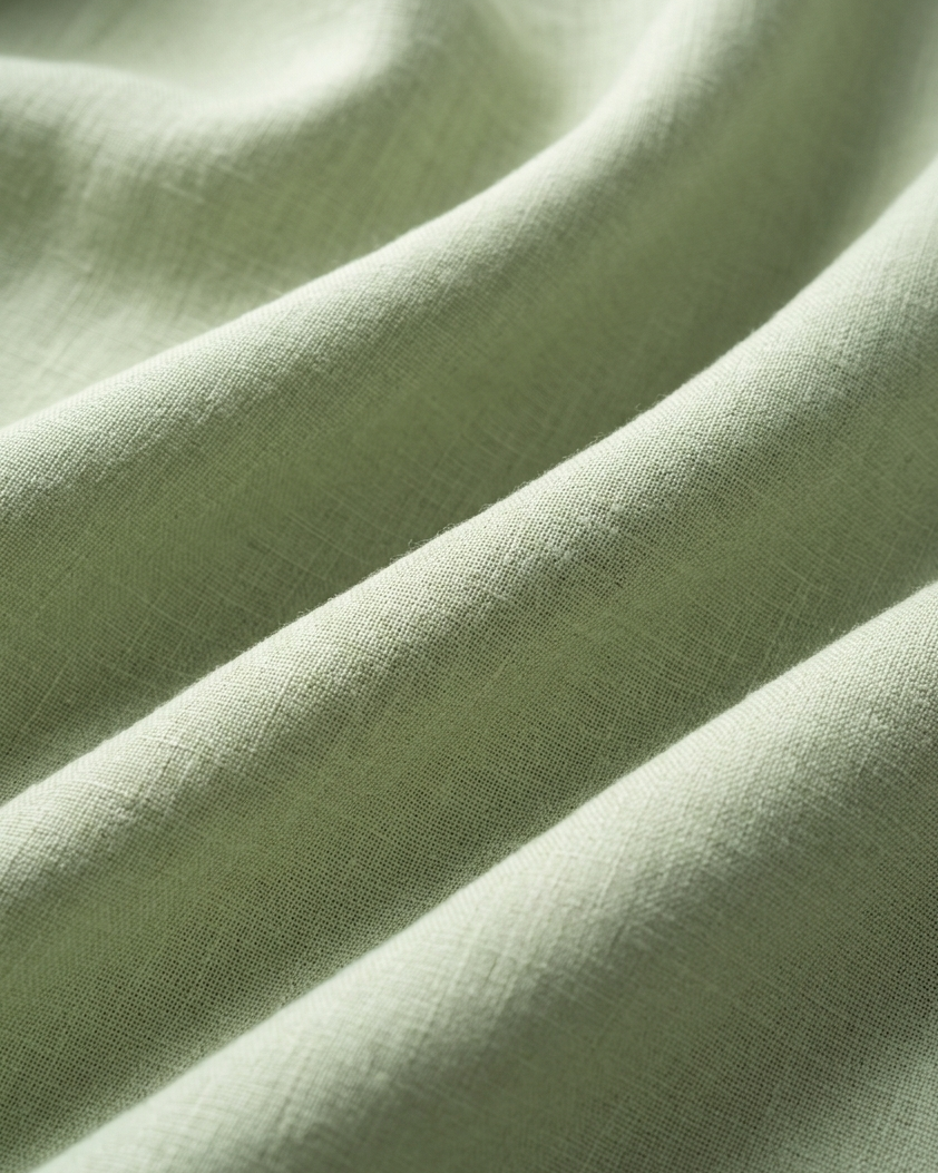 Close-up of green fabric with folds